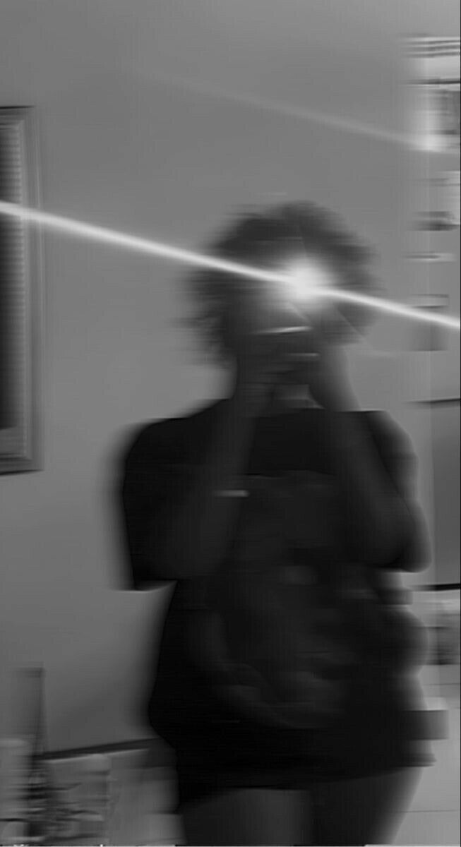 a blurry image of a woman walking in a room