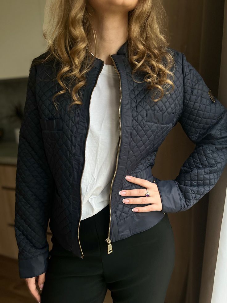 A timeless addition to your wardrobe: the Vintage Burberry Brit navy blue jacket for women. This spring vintage piece exudes sophistication and charm, perfect for elevating your style.  Crafted with Burberry's signature quilting, it offers both elegance and warmth. Sized between S-M, this classy women's Burberry jacket is a must-have for any fashion enthusiast.  Embrace the nostalgia of Burberry's iconic designs with this elegant vintage find. Size: on label XL, but it better would fit for S-M s Chic Quilted Jacket For Workwear, Elegant Quilted Outerwear For Work, Chic Quilted Jacket For Fall Workwear, Elegant Quilted Outerwear For Office, Fitted Quilted Jacket For Fall Workwear, Navy Quilted Outerwear For Fall, Quilted Fitted Outerwear For Work, Chic Long Sleeve Quilted Jacket For Work, Fitted Quilted Outerwear For Work