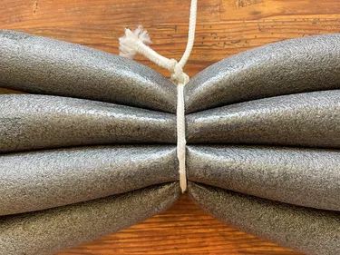 a close up of a bow tie on a wooden table