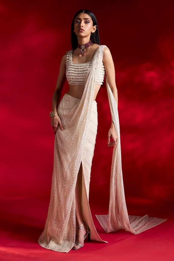 Ivory pre-draped saree with pearl, cutdana embroidery. Paired with a blouse with tassels all over. - Aza Fashions Draped Saree Gown, Ivory Saree, Net Sari, Indian Bridesmaid Dresses, Draped Saree, Reception Outfit, Saree Gown, Drape Saree, Draped Skirt