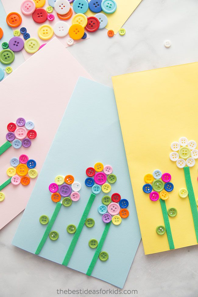 three cards with flowers made out of buttons on them, one is yellow and the other is pink