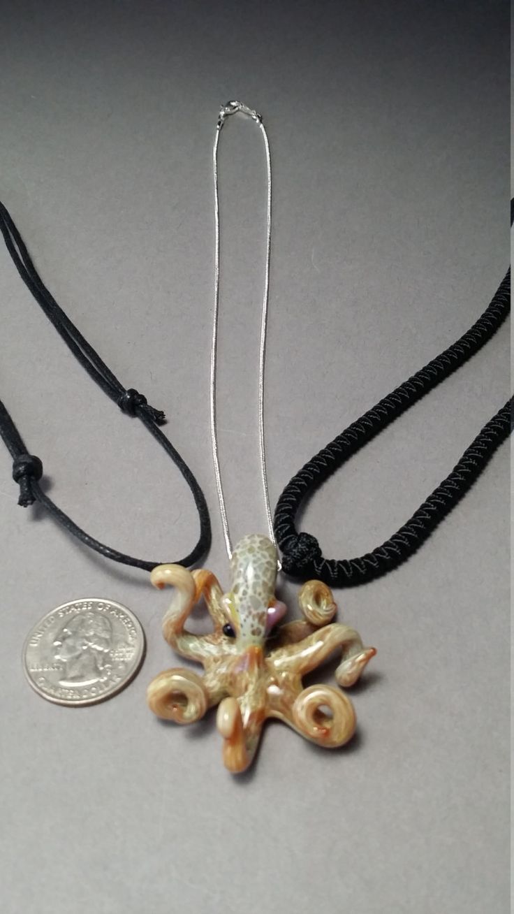 Glass Octopus focal bead pendant would make a great gift for a guy or gal. A fantastic gift for you friend or for yourself. Looking something for someone who loves the ocean or who want have a reminder of the last beach party or a dive trip, THIS IS THE GUY! I have studied these animals in their natural settings and I try to form them in a way to represent what they are in reality and capture that ocean life feel. This one is about 1-1/2 inches long. CORD OR CHAIN: You can request for a Guy or G Novelty Jewelry With Lobster Clasp For Gift, Themed Necklace With Lobster Clasp As Gift, Themed Round Pendant Jewelry For Gifts, Themed Round Pendant Jewelry As Gift, Spiritual Jewelry With Adjustable Cord For Gifts, Spiritual Jewelry With Adjustable Cord As Gift, Personalized Ocean-inspired Jewelry Gift, Novelty Necklace With Lobster Clasp For Gift, Glass Jewelry With Large Pendant As A Gift