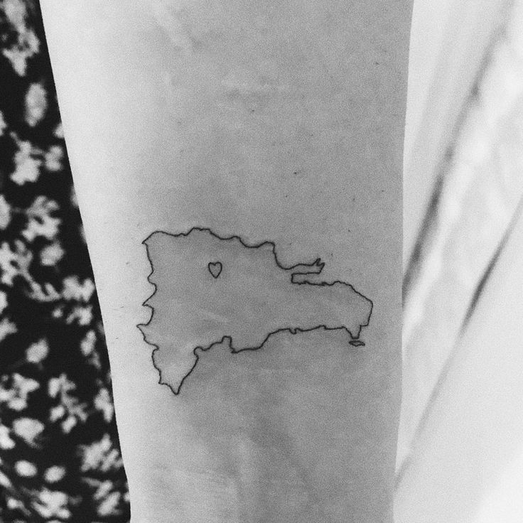 a black and white photo of a map tattoo on the left inner arm, with dots in it