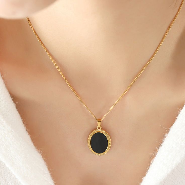 Black White Oval Mother of Pearl Pendant Necklace Minimalist Oval Stainless Steel Jewelry, Black Enamel Oval Necklace As Gift, Black Enamel Oval Necklace For Gift, Black Oval Link Jewelry For Gifts, Elegant Black Oval Pendant Necklace, Elegant Oval Pendant Necklace With Black Enamel, Gold Necklace With Black Enamel Oval Pendant, Black Round Locket Necklace, Gold Oval Necklace With Black Enamel