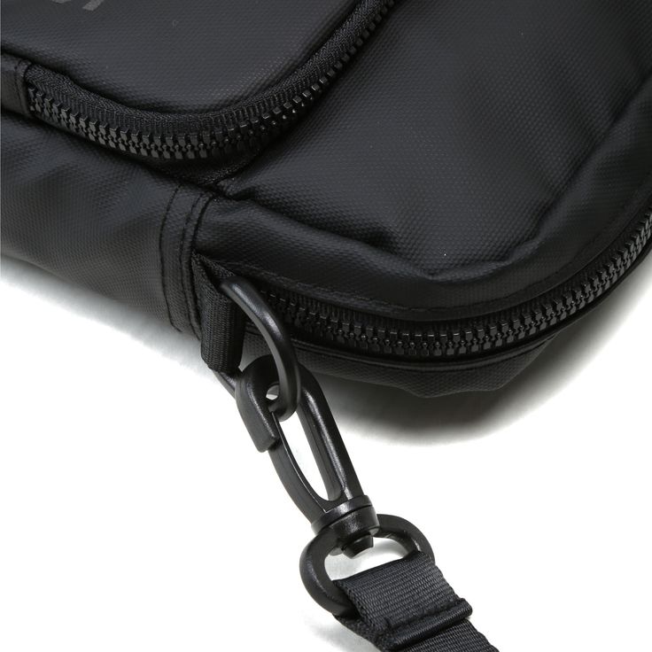 Get the Deets: 8" tall x 5" wide x 2" deep Main compartment: 5 W x 8 H Front pocket: 5 W x 6 H Main compartment holds up to 3 L. Two separate carrying compartments. Front pocket includes an elastic key/wallet clip. Removable, adjustable shoulder strap with swivel clips. Interior pockets, including phone sleeve (fits any size phone). Multiple interior elastic organizational slots for pens, lip balm and other small essentials. Matching zipper pulls & main compartment liner. Basic Black Functional Black Crossbody Phone Bag, Functional Rectangular Shoulder Bag With Cell Phone Pocket, Black Crossbody Mobile Phone Pouch, Black Crossbody Chest Bag With Cell Phone Pocket, Practical Rectangular Chest Bag With Zipper Pocket, Functional Crossbody Phone Bag For School, Functional Mobile Phone Pouch Chest Bag, Functional Phone Bag With Pockets, Functional Chest Bag With Mobile Phone Pouch