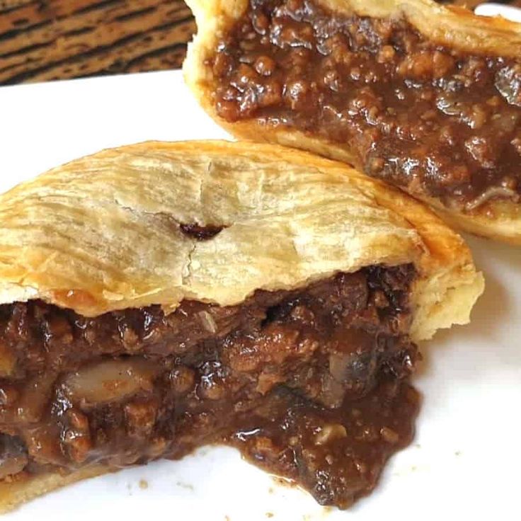 two pieces of meat pie on a plate