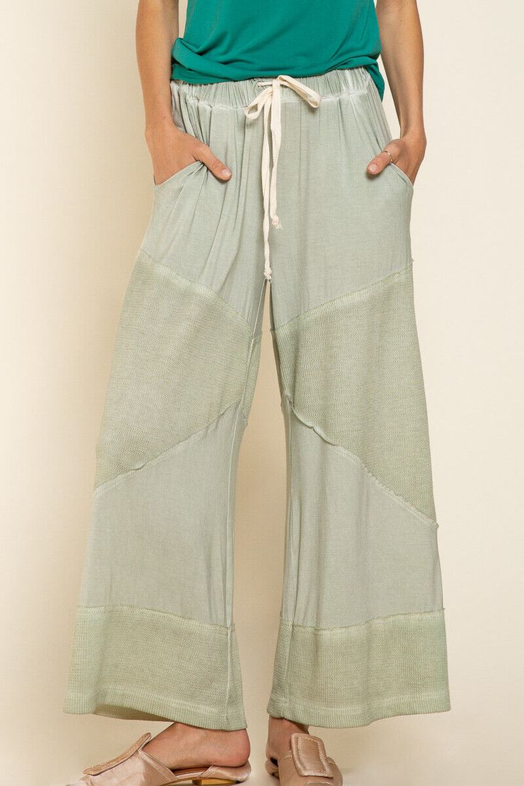 Flowy loose knit culotte palazzo pants featuring ribbed fabrication on contrast and finished with an elastic waistband with adjustable drawstring.  Breezy lounge pants, perfect for outdoor gatherings or walks on the beach. Loose fit Washed soft fabric Front dual pockets Drawstring waistband Fabric: 94% Rayon 6% Spandex Color: Desert Sage Dimensions: Small/Medium:  Waist: 30" Inseam: 24.5" Length: 35" Medium/Large:  Waist: 32" Inseam: 24.5" Length: 35"    Return Policy Items must not be worn or w Desert Sage, Culotte Pants, Style Finder, Beach Pants, Loose Knit, Knit Pants, Drawstring Waistband, Sheer Fabrics, Workout Pants