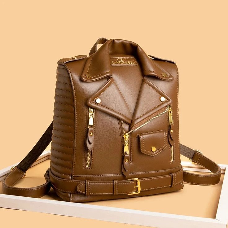 Elevate your ensemble with our Premium Leather Backpack, a blend of sophistication and utility. Meticulously crafted with attention to detail, this designer accessory exudes timeless elegance. Its sleek silhouette and high-quality leather construction make it a versatile addition to any wardrobe. This backpack effortlessly elevates your look while offering ample storage for your essentials. Step up your fashion game with this must-have piece, tailored for the modern woman who values style and practicality. Lining Material: High-quality Synthetic Leather Interior Slot Pocket Interior Cell Phone Pocket Interior Zipper Pocket Interior Compartment Alternative Aesthetic, Trend Clothes, Women Leather Backpack, Personal Belongings, Women Bags Fashion, Bag Trends, Large Backpack, Designer Backpacks, Branded Bags