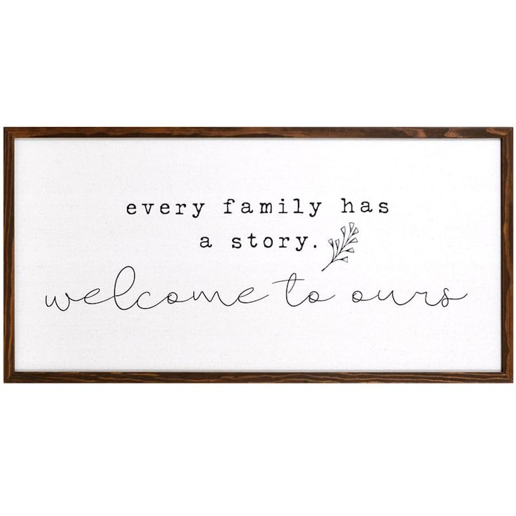 a framed sign that says, every family has a story welcome to ours