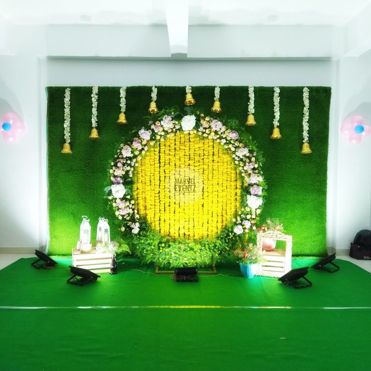 the stage is decorated with flowers and candles