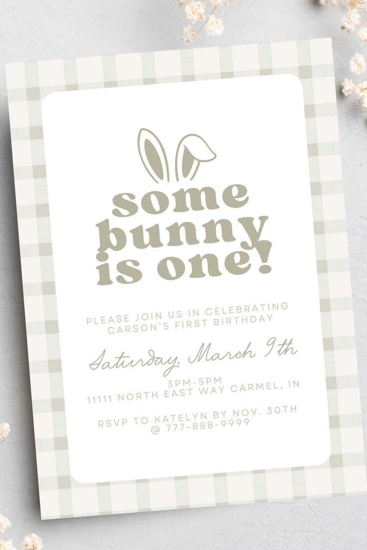 some bunny is one birthday party card on a gray and white checkered tablecloth