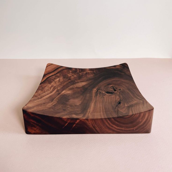 a piece of wood sitting on top of a table