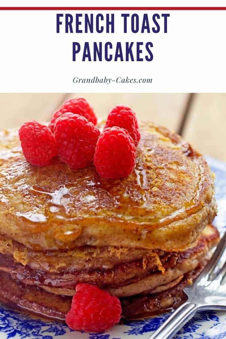 french toast pancakes with raspberries on a blue and white plate next to a fork