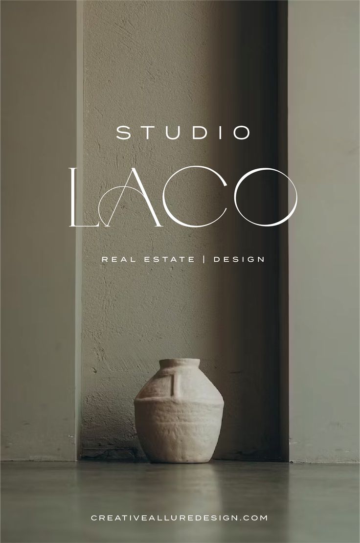 a white vase sitting in front of a wall with the words studio laco on it