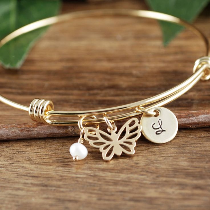 "Take a LOOK at our Website: ANNIEREH.com GOLD Butterfly Initial Bracelet, Butterfly Bracelet, Butterfly Jewelry, Gold Butterfly Bangle Bracelet, Memorial Jewelry, Sympathy Jewelry This listing is for a gold or silver pineapple bangle Details for Bracelet: * Stainless Steel Bangle - Silver or Gold * Butterfly Charm - Sterling Silver or Gold Bronze * 3/8\" Round Initial - Sterling Silver or Gold * ONE pearl or birthstone of your choice Please note all details for bracelet in our note to seller bo Adjustable Gold-tone Charm Bracelet Gift, Adjustable Gold Chain Bracelet Nickel-free, Adjustable Gold Chain Bracelet Nickel Free, Hypoallergenic Gold Metal Bracelet As Gift, Hypoallergenic Metal Gold Bracelet As Gift, Hypoallergenic Gold Metal Bracelet For Gift, Personalized Yellow Gold Metal Bracelets, Personalized Yellow Gold Metal Bracelet, Adjustable Gold Bracelet With Charms