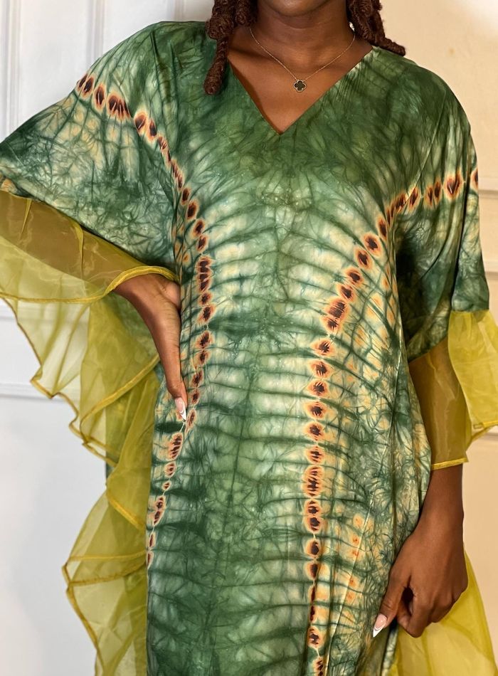 Bask in the sun's kiss with this exquisite Tie Dye Dress, proudly crafted by artisans in Nigeria. This blend of casual and classy is a limited edition - perfect for those who value unique style. Embrace this special look and let your radiance shine! Fitted V-neck Kaftan For Vacation, Elegant Green Beach Cover-up Dress, Elegant Green Maxi Dress For Festival, Bohemian V-neck Silk Dress, Elegant Green Dress For Festival, Green Silk Beachwear Dress, Summer V-neck Silk Dress, Long Sleeve Silk Beach Dress, Bohemian Long Sleeve Silk Dress