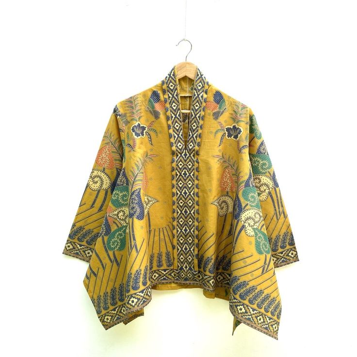 Blouse: - Soft cotton material with soft colors and premium prints - Premium stitches are very neat - All size fit to XXXL Bust 116 cm - 51 cm long arm & 44 cm arm circumference - Brooch sold separately Traditional Printed Yellow Tops, Traditional Yellow Tops With Printed Motifs, Traditional Multicolor Batik Print Blouse, Traditional Batik Print Patterned Blouse, Traditional Patterned Printed Blouse, Traditional Patterned Blouse With Motif, Batik Blouse, Women Blouse, Work Tops