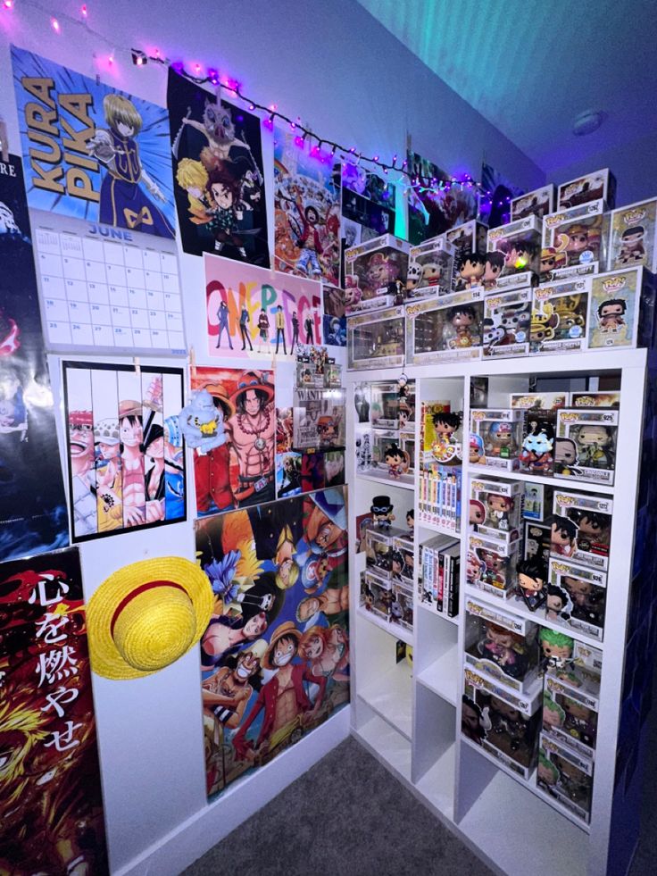 a room filled with comic books and pictures on the wall next to a yellow frisbee