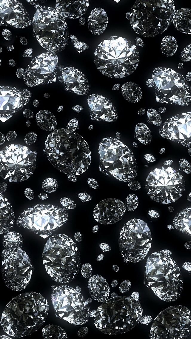 many diamonds are arranged in rows on a black background