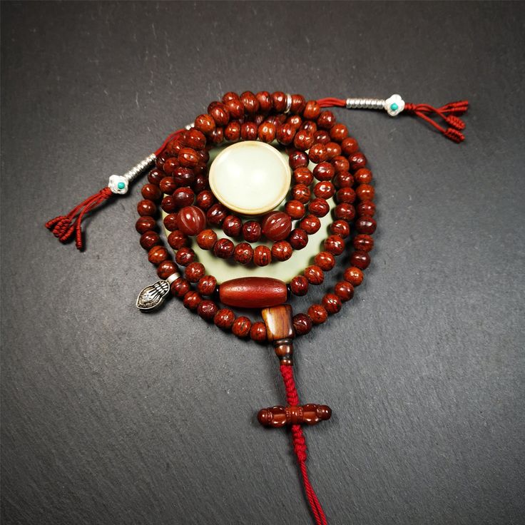 ❤This bodhi beads mala is made by Tibetan craftsmen and come from Hepo Town, Baiyu County, the birthplace of the famous Tibetan handicrafts,about 30 years old, hold and blessed by a lama in Baiyu Monastery.It is composed of 108 bodhi seed beads, and is equipped with 3 agate beads, silver bead counters are installed on both sides, 1 mani jewel bead clip,and finally consists a bone guru bead and vajra on the end, very elegant.❤Details1. Handmade 108 bodhi beads approximately 8mm,mala's perimeter i Bohemian 108 Beads Mala For Blessing, Bohemian Mala With 108 Beads For Blessing, Hand-strung Spiritual Beads For Blessing, Traditional Gemstone Beads Rosary For Meditation, Spiritual Rosary With Round Beads For Meditation, Spiritual Rosary For Meditation With Round Beads, Bohemian Mala With 8mm Beads For Blessing, Spiritual Wooden Beads For Puja, Spiritual Wooden Beads Rosary For Meditation