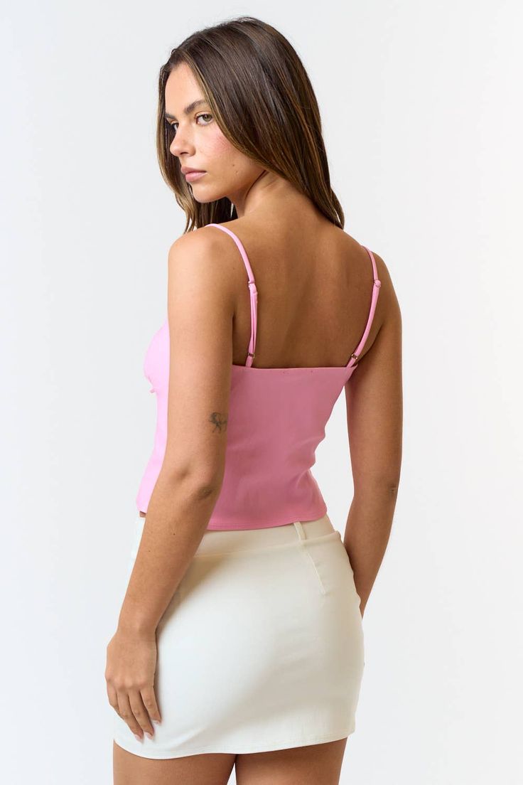 This pink front tie cami top is a total vibe! 😍 The soft pastel pink is perfect for brightening up your outfits, and the front tie detail adds that extra cute touch. With adjustable spaghetti straps and lightweight fabric, it's all about comfort and style. Pair it with your go-to high-waisted jeans or a flirty skirt for a look that's effortlessly chic. Whether you're heading to brunch or out with friends, this cami is your new go-to for a fresh, fun look! 🌟💖 Feminine Spring Crop Top With Built-in Bra, Flirty Spring Tank Top With Built-in Bra, Pink Tops With Built-in Bra For Day Out, Trendy Camisole With Built-in Bra For Spring, Pink Cami Crop Top With Straps, Pink Strappy Cami Crop Top, Pink Fitted Crop Top With Spaghetti Straps, Feminine Spring Tank Top With Tank Straps, Pink Camisole Crop Top With Straps