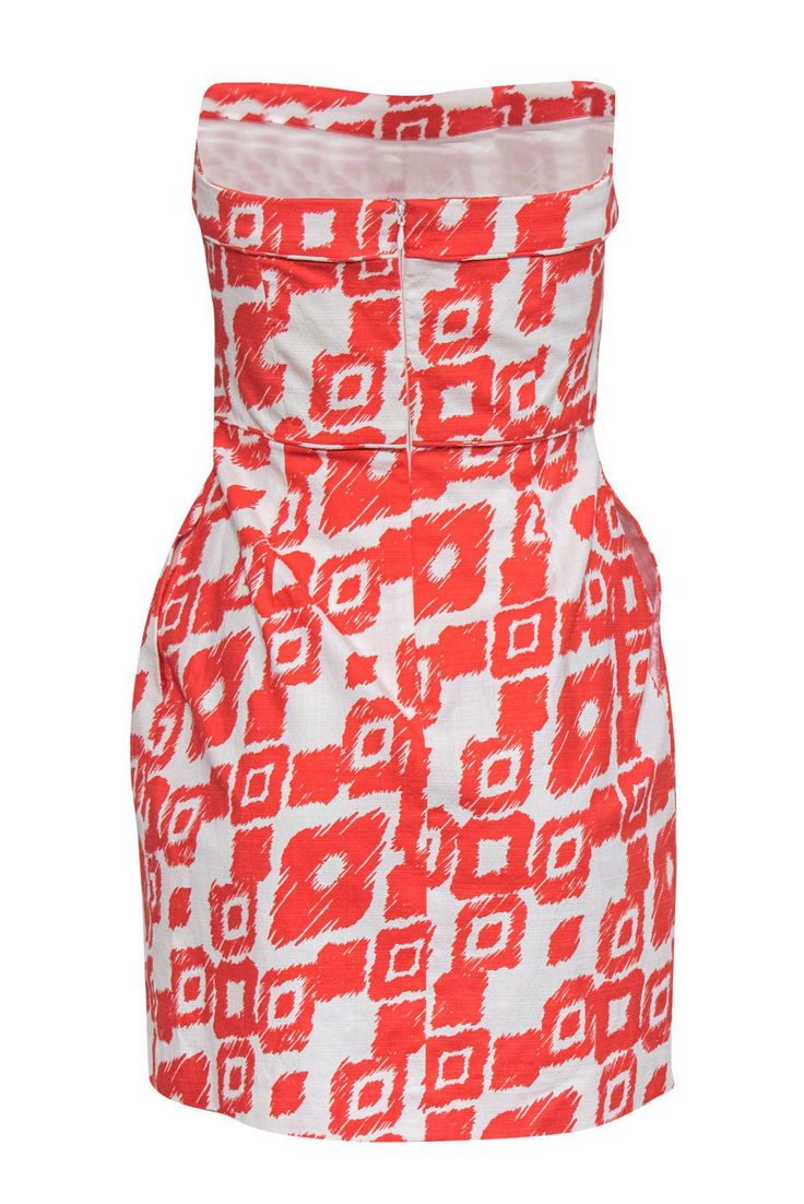 Add a pop of prints to your dress collection with this Shoshanna piece! Featuring a vibrant orange print, this chic little cocktail dress is perfect for a summer soiree. Pair with sparkly heels and a clutch for an eye-catching look. Size 2 Shell: 99% Cotton, 15 Spandex Lining: 100% Acetate Concealed back zipper Lined Sheath silhouette Sweetheart neckline Sleeveless, strapless Orange and white printed design Bust 31" Waist 28" Total length 28" Orange Fitted Dress With Straight Neckline, Orange Strapless Mini Dress For Summer, Bold Dresses For Spring Vacation, Printed Cocktail Dresses For Summer, Summer Cocktail Printed Dresses, Summer Party Dress With Abstract Print, Abstract Print Summer Party Dress, Bold Summer Vacation Dresses, Sleeveless Abstract Print Dress For Day Out