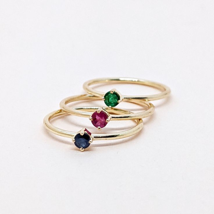 Natural Ruby, Emerald, Sapphire Round Cut Stackable Ring, Set of Gold Ring. Precious Gemstone Ring in 14k SOLID GOLD For Her from our Capsule Jewelry Collection.  Ruby, Emerald, Sapphire Stone is set in Prong Setting in our Factory. Gold Ring AAA+ Quality. Perfect Gift For Everyday or Gift for Your Loved Ones. ►  DIMENSIONS :  ◆ Gemstone : Emerald, Ruby, Sapphire                       ◆ Stone size : 3*3 mm                           ◆ Gross Weight : 1.100 grams (1 Ring) ◆ Shank Width : 1 mm      ◆  Material :  14k Yellow Gold      EACH Ring is Stamped With 585 Marked As 14k GOLD International Standard. All my gemstones are hand-selected for best quality assurance, then precisely sawed, and shaped into the desired geometry. The precious stones are then delicately grinned, sanded, and hand-po 14k Gold Ruby Ring With Round Band, Dainty Yellow Gold Birthstone Gemstones, Diamond Stackable Rings For May Birthstone, Stackable Yellow Gold Crystal Ring In 14k, Stackable Yellow Gold Gemstones For Gift, Diamond Stackable Rings With May Birthstone, Yellow Gold Stackable Crystal Ring In 14k, Classic Crystal Ring With Birthstone In Round Cut, Stackable Sapphire Diamond Ring As Gift