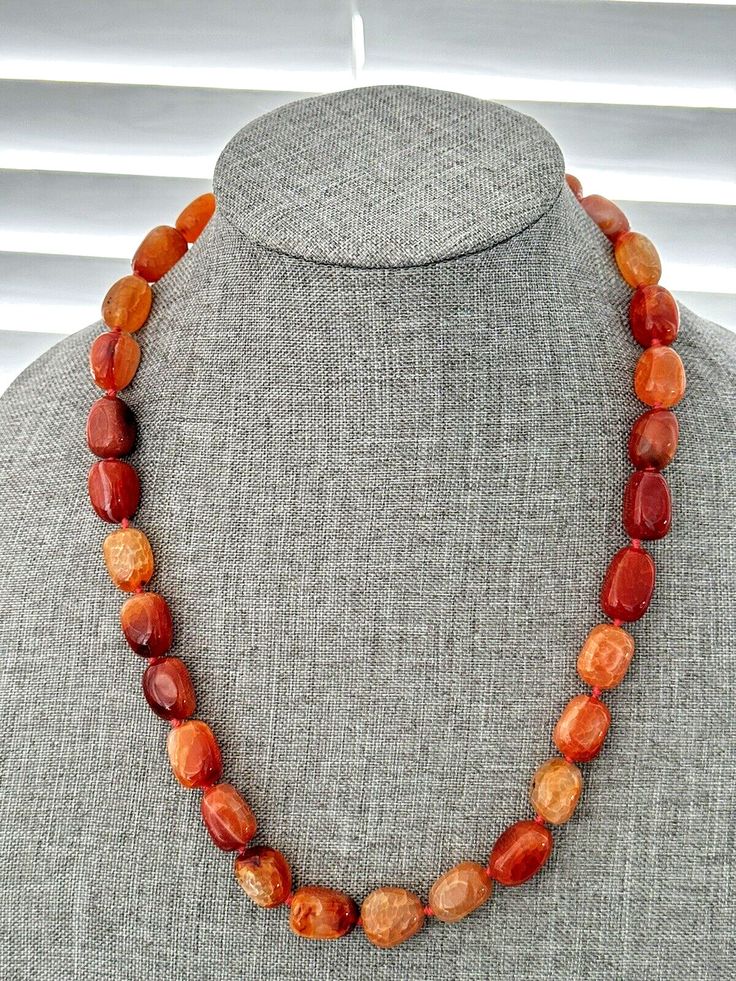 Elevate your style with this stunning Snake Skin Agate Necklace! 🐍🧡 With 29 beautifully polished oval gemstones in a mix of amber and orange colors, this 20" necklace is perfect for any occasion. The toggle closure adds a touch of elegance to this gemstone beauty. #SnakeSkinAgate #GemstoneNecklace #OrangeAndAmber #FashionStatement #JewelryLover 🌟  #eBay #Agate #Gemstone Amber Gemstone Necklace With Round Beads, Polished Tumbled Bead Necklaces As Gifts, Tumbled Polished Bead Necklaces For Gifts, Tumbled Polished Beads Necklace For Gifts, Adjustable Tumbled Gemstone Necklaces, Adjustable Gemstone Necklaces, Oval Agate Necklace For Healing, Bohemian Single Strand Agate Necklace, Agate Necklaces With Oval Beads For Gifts