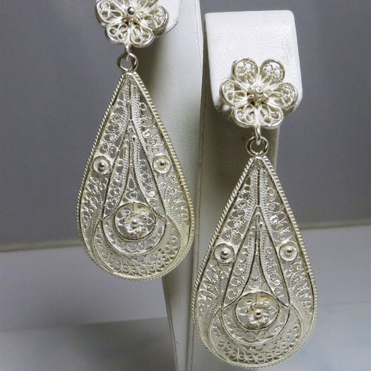 High Detail & Quality Fascinating "Frosted" .925 Sterling Silver Diamond Cut Filigree 2 Piece Drop / Dangle Earrings Stud & Butterfly Fasteners Size = 2 1/2" Drop Width = 1" Weighs = 6.1 Grams Each Dangle Filigree Bridal Earrings, White Teardrop Earrings With Intricate Design, Silver Filigree Earrings For Party, Ornate White Sterling Silver Earrings, White Filigree Drop Earrings, Formal Filigree Clip-on Earrings, Ornate White Pierced Earrings, White Intricate Design Dangle Earrings, White Intricate Design Drop Earrings