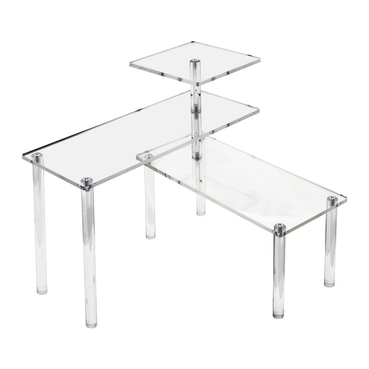 two clear glass tables sitting on top of each other in front of a white background