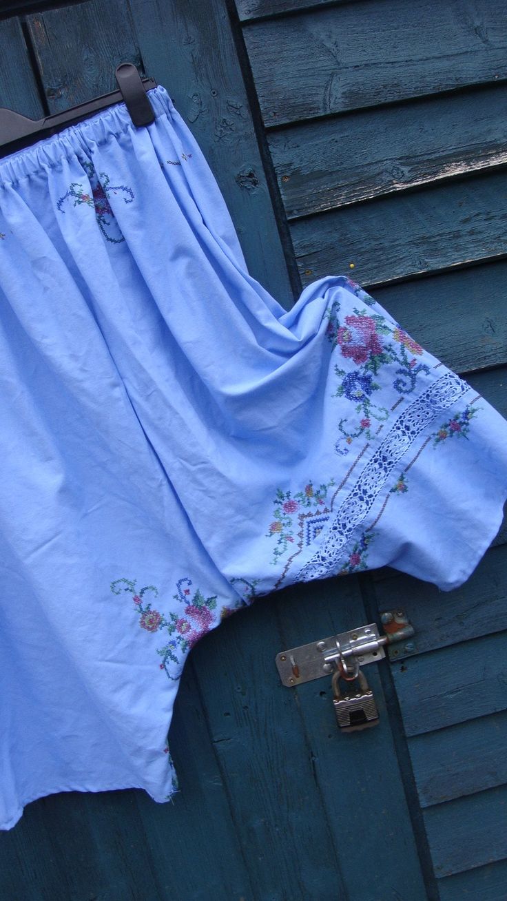 This is a pair of my harem/wide legged bloomers/pants. LISTING IS FOR PANTS ONLY XXXX These beauties have been fashioned from a vintage cotton embroidered tablecloth. These have been dyed to this fabulous and eye catching cornflower blue! The colour alone, I feel, makes these extra special but with the added embroidery and crochet work, these are amazing! These have a deep elasticated waistband for comfort and easy pull on style! A simple pull on style, freshly laundered and ready to wear.. Thes Blue Floral Embroidered Wide Leg Bottoms, Blue Bohemian Embroidered Pants, Bohemian Blue Embroidered Pants, Blue Cotton Bottoms With Embroidered Hem, Blue Floral Embroidered Pants For Summer, Spring Blue Cotton Bloomers, Embroidered Cotton Bottoms For Daywear, Vintage Blue Summer Pants, Bloomers Pants