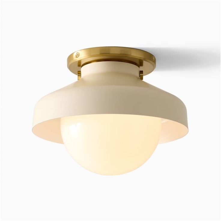 a light fixture with a white and gold finish on the top, against a white background