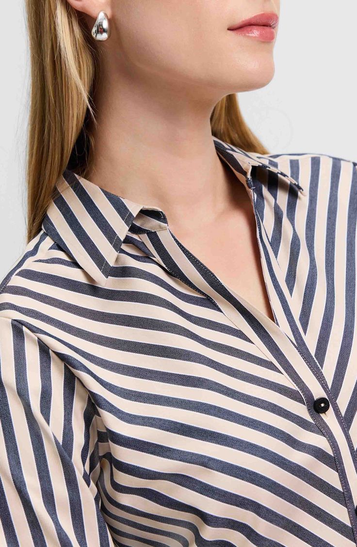 Look crisp and polished all day in this button-up shirt made from a non-iron cotton blend and finished with yarn-dyed stripes. 28" length (size 8) Front button closure Spread collar Long sleeves with button cuffs 58% cotton, 37% polyester, 5% spandex Machine wash, tumble dry Imported Vertical Stripes Button-up Business Casual Shirt, Vertical Stripes Button-up Shirt For Business Casual, Business Casual Vertical Stripes Button-up Shirt, Business Casual Button-up Shirt With Vertical Stripes, Striped Button-up Shirt For Business Casual, Striped Collared Blouse For Work, Pinstripe Collared Shirt For Work, Striped Button Shirt For Work, Striped Buttoned Shirt For Business Casual