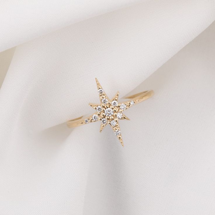 14k solid gold large starburst diamond ring featuring total 0.14ctw white diamonds is available in yellow gold, rose gold, and white gold. Starburst measures approximately 13mmx16mm, it is a large starburst which will be eye-catching for anyone who sees your finger. With carefully handset pave diamond, the ring creates maximum sparkles. * Star size: ≈13mm x ≈16mm * Diamond weight: ≈0.14ctw / G SI1 * Made of 100% recycled precious metal and ethically sourced gemstone * Comes in a gift box with a Star-shaped Diamond Ring With Single Cut Diamonds, Star-shaped Diamond Ring With Single Cut Diamonds For Wedding, Star-shaped Wedding Diamond Ring With Single Cut Diamonds, Wedding Star-shaped Diamond Ring With Single Cut Diamonds, 14k Gold Star-shaped Diamond Ring With Single Cut Diamonds, Celestial Style Rose Gold Diamond Ring, Star-shaped Diamond Anniversary Ring, Celestial Diamond White Diamond Ring, Celestial Style Diamond White Diamond Ring