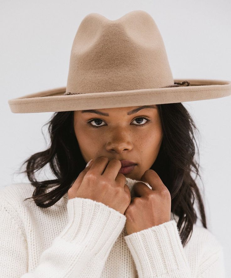 Distinctive and chic, the Maude wide brim fedora hat is inspired by our love of modern shapes taken from traditional silhouettes. The structured curves + subtle pinch of the crown on this wide brim felt hat creates a modern take on a classic felt fedora shape. With a wide pencil roll brim, the Maude felt fedora is set apart from the rest. Fall Panama Hat With Curved Brim In Fur Felt, Chic Flat Crown Fedora For Fall, Modern Wide Brim Fedora For Everyday, Elegant Felt Hat For Everyday Fall Wear, Elegant Everyday Felt Hat For Fall, Elegant Flat Brim Felt Hat For Everyday, Modern Adjustable Brimmed Fedora, Chic Fur Felt Fedora For Fall, Modern Fedora Hat For Fall