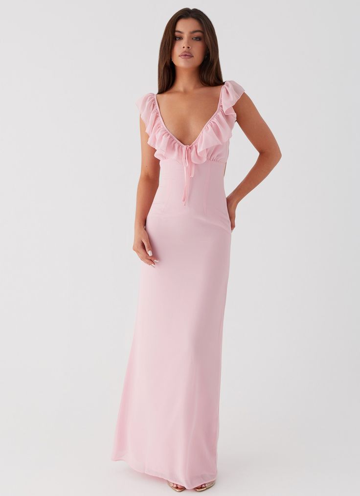 Peppermayo Exclusive Elevate your evening look with the Silvie Maxi Dress. Featuring a V neckline, frill straps, and delicate frill detailing at the neckline. Embrace the magic of balmy nights and shimmering silhouettes.       - Maxi length- V neckline- Frill straps and neckline detail- Open back- Adjustable straps- Ti Pink Revolve Dress, Rehearsal Dinner Dress Pink, Pink Banquet Dresses, Pretty Pink Dresses Classy, Pink Maxi Dress Aesthetic, Revolve Dress Long, Frilly Bridesmaid Dress, Pink Asymmetrical Dress, Woman Officiant Outfit