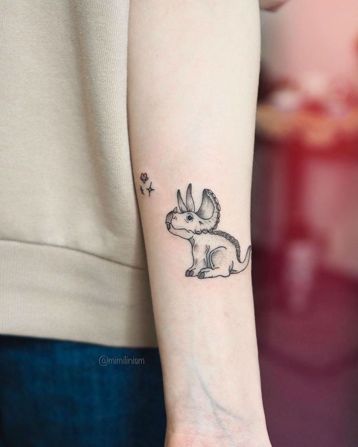 a small rabbit tattoo on the wrist