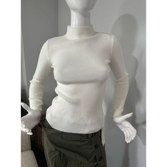 Elevate Your Wardrobe With This Sophisticated Cream Turtleneck Sweater. Perfect For Layering Or Wearing Alone, Its Ribbed Texture And Fitted Silhouette Create A Sleek, Flattering Look. Ideal For Office Wear, Casual Outings, Or Cozy Evenings In. The Versatile Cream Color Pairs Effortlessly With Any Outfit, Making It A Must-Have Staple For Your Fall And Winter Wardrobe. Style: Turtleneck Type: Sweater Color: Cream Department: Women Material: Knit Sleeve Length: Long Sleeve Features: Fitted, Ribbed Fitted Spring Sweater, Elegant Fitted Top With Ribbed Collar, Trendy Fitted Sweater, Spring Ribbed Sweater, Chic Fitted Tops With Ribbed Collar, Casual Fitted Sweater With Ribbed Neckline, White Fitted Sweater With Ribbed Neckline, Chic High Stretch Sweater For Spring, Chic High Stretch Spring Sweater