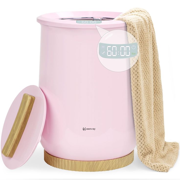 a pink electric trash can with a wooden lid next to a beige towel and a white clock