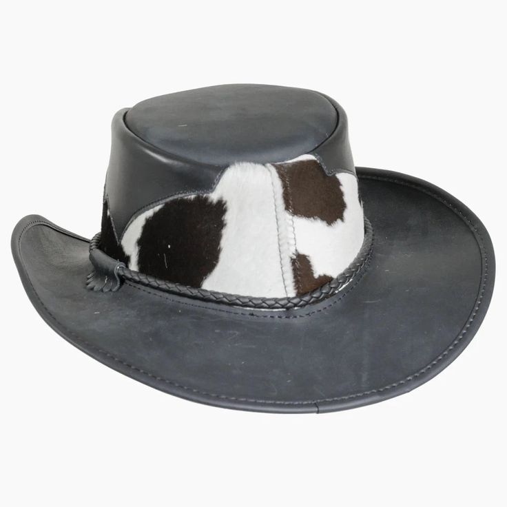 Pinto | Mens Leather Cowboy Hat with Calf Accents blends rugged cowhide and hair-on calfskin for a distinctive, bold look. The triple-braided band with tassel adds a unique touch, making this Outback hat perfect for outdoor adventures. Material: Genuine Leather with Hair-On Calfskin Shape: Outback Trim: Triple-Braided Band with Tassel Brim Size: 3” Crown Height: 4” Sweatband: AHM Velcro Assembled in the USA Rugged Leather Hats For Western-themed Events, Rugged Leather Hat Bands For Ranch, Leather Brimmed Fedora For Rodeo, Leather Fedora Hats For Rodeo, Rustic Leather Fedora For Rodeo, Rustic Leather Fedora For Western-themed Events, Wide Brim Leather Fedora For Western-themed Events, Leather Wide Brim Fedora For Western-themed Events, Western High Crown Top Hat For Ranch