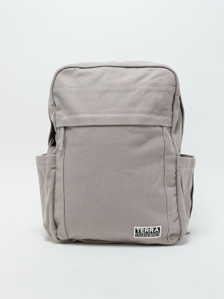 Need a backpack that's both sustainable and practical for college, school everyday use or outdoor activities? Our Earth Backpack is perfect for you. Our spacious and durable Earth Backpack is the workhorse of our line, built for everyday carry with heavy-duty certified organic cotton canvas. The generous main compartment is divided with a no-fuss sleeve for your laptop and one small interior pocket to keep things organized. Two water bottle sleeves and the large zippered exterior pocket keep hyd Durable Backpack For Everyday Use, Practical Durable Backpack For Everyday Use, Durable Standard Backpack For Everyday Use, Versatile Durable Backpack For Everyday Use, Rectangular Durable Backpack For Everyday Use, Durable Rectangular Backpack For Everyday Use, Rectangular Everyday Durable Backpack, Durable Functional Backpack For Everyday Use, Durable Everyday Functional Backpack