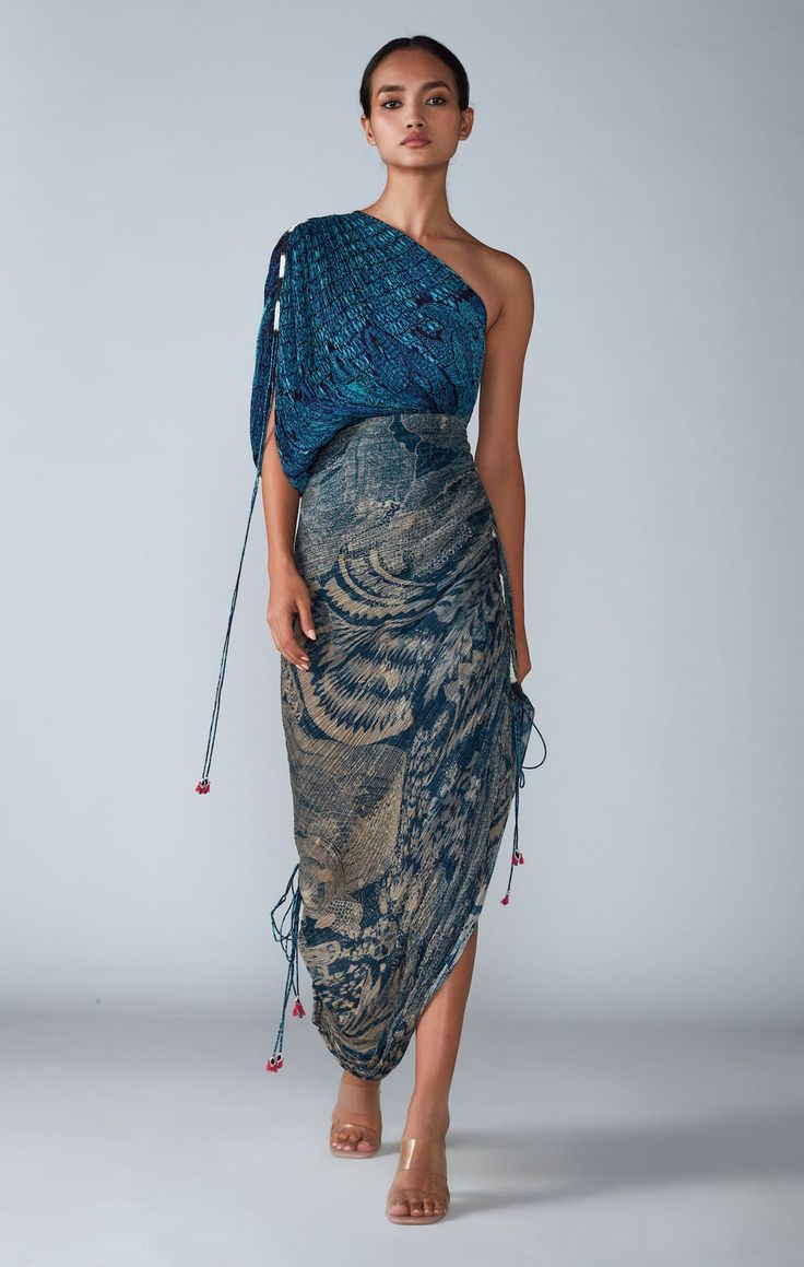 Editor's Note Abstract Bird & Tile Dual Print Hand Micro Pleated Sari Dress Fabric: Cotton Silk Color: Blue Care: Dry Clean Only About the Designer Saaksha & Kinni is our vision, our expression and our ode to tradition. All the while keeping on mind our tradition and roots in India – Our bold prints, metal, and Festive Draped Silk Dresses, Traditional Drape Silk Dresses For Reception, Summer Reception Draped Dress, Festive Pre-draped Dress For Reception, Traditional Draped Reception Dress, Blue Draped Festive Dresses, Traditional Drape Summer Dress For Reception, Traditional Drape Summer Reception Dress, Summer Reception Dress With Traditional Drape