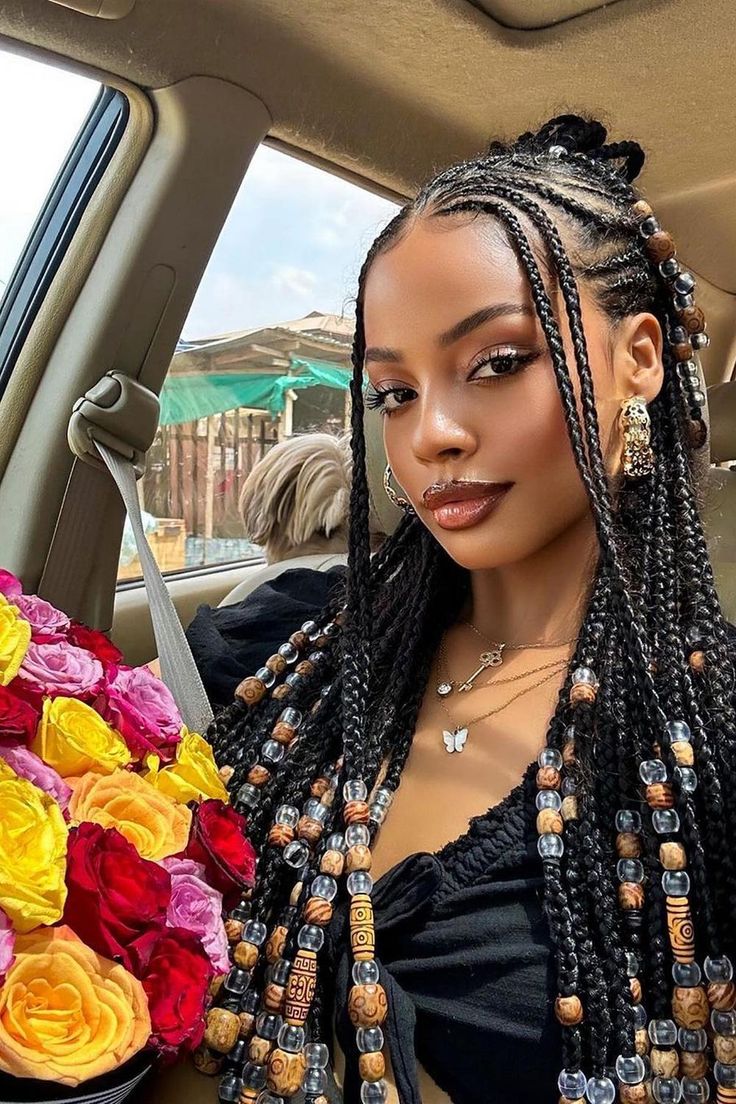 Beaded box braids with a creative touch add both elegance and edge. Incorporating wooden and transparent beads, the style showcases a mix of textures that elevate the classic braiding technique. It's a statement look that pairs well with any outfit.  // Photo Credit: Instagram @braidsgang Black Women Hairstyles Beads, Wooden Beads In Hair, Mexico Hairstyles Black Women, Wooden Beads On Braids, Box Braids Wooden Beads, Braid Inspo Mixed Girl, 2 Step Braids, Shoulder Box Braids, Wooden Beads Braids