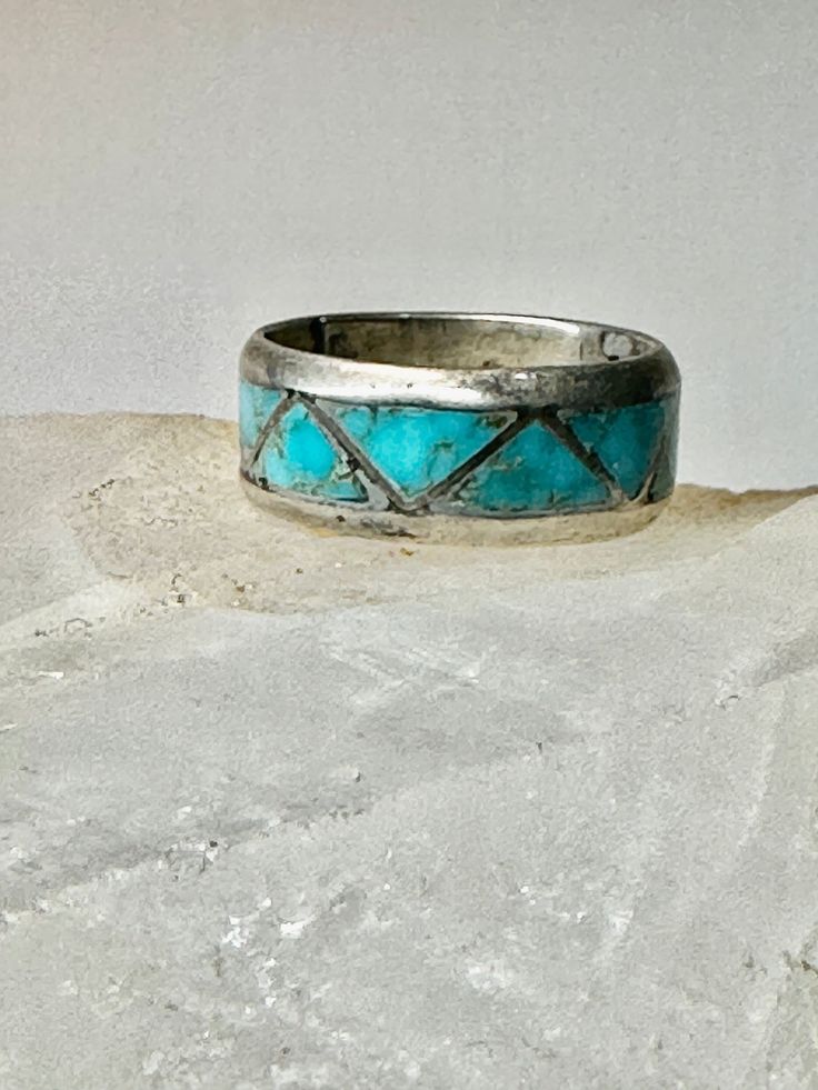 "Zuni ring Turquoise wedding band size 6.50 sterling silver women men Size  6.50 Weight  4.1g  Width   1/4\" Free Shipping & Free/4 Postal Insurance  Delivered in a Gift Box  Free First Class shipping and postal insurance is included. If you want to upgrade to priority kindly pay an additional fee to do so.  This is recommended if you would like to have your package delivered faster than first class which has slowed down" Round Patina Rings For Anniversary, Silver Patina Jewelry For Weddings, Turquoise Ring With Patina For Anniversary, Stamped 925 Turquoise Ring For Wedding, Turquoise Round Band Ring For Anniversary, Wedding Turquoise Ring Stamped 925, Silver Stackable Turquoise Ring For Anniversary, Turquoise Toe Ring Jewelry For Anniversary, Turquoise Vintage Promise Ring