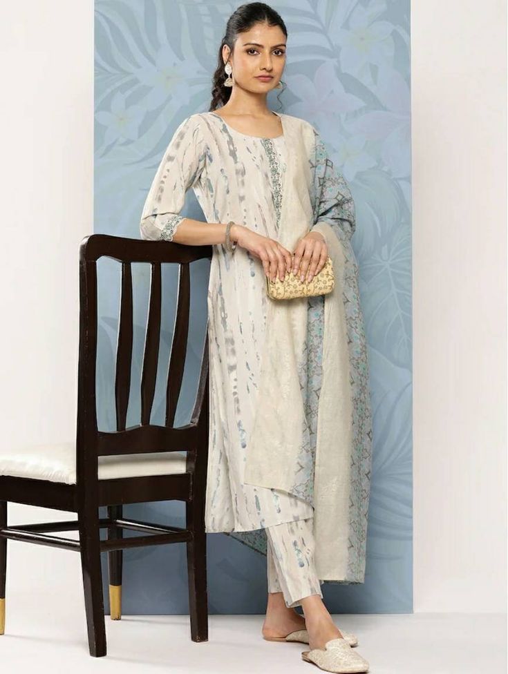 *Printed Regular Sequinned Kurta With Trousers & With Dupatta Pakistani Salwar Kameez / Indian Wedding Dress / Plus Size Cotton Dress Traditional Indian Wear / Salwar Kameez Dupatta / Kurti Palazzo Set   *Grey printed Kurta with Trousers with dupatta *Kurta design:-  *  Abstract printed   *  Straight shape   *  Regular style   *  Round neck, three-quarter regular sleeves   *  2 pockets sequinned detail   *  Calf length length with straight hem   *  Silk blend machine weave fabric *Trousers design:-  *  Printed Trousers   *  Partially elasticated waistband   *  Slip-on closure *Fabric:- Silk Blend Wash Care:- Hand Wash  AVAILABLE IN 7 SIZES THEY ARE IN FOLLOWING MEASUREMENTS IN INCHES:- XXS:- Bust-32/Shoulder-13/Top Length-45/Bottom Waist-24/Bottom Length-36/Hip-36 XS:- Bust-34/Shoulder-13. Cambric Dresses With Printed Motifs For Wedding, Semi-stitched Cotton Dress For Wedding, Cotton Palazzo Set With Printed Motifs For Wedding, Cotton Traditional Wear With Printed Motifs For Wedding, Semi-stitched Cotton Wedding Dress, Eid Wedding Palazzo Set With Printed Motifs, Wedding Palazzo Set With Printed Motifs And Straight Kurta, Wedding Straight Kurta Set In Cambric, Wedding Kurta For Navratri In Cambric