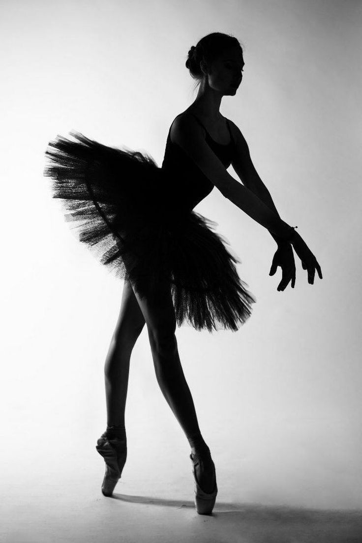 a black and white photo of a ballerina