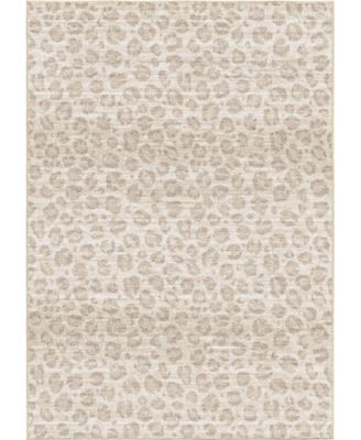 a beige and white rug with an animal print pattern on the bottom, in front of a