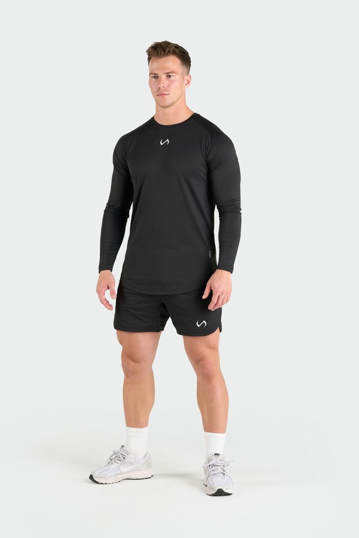 Introducing the long sleeve rendition of our Micro Mesh Tee - a fusion of style and functionality for those who demand peak performance from their gym-wear. Crafted to enhance your physique, this long sleeve gym tee boasts raglan sleeves, along with curved front and back hems, ensuring a fit that moves with you seamlessly from the gym to the streets. Engineered with our signature Micro Mesh DNA™, it not only enhances breathability and moisture-wicking but also embodies a modern aesthetic. Sporty Long Sleeve Rash Guard With Thumbholes, Technical Long Sleeve Activewear For Light Sports, Stretch Long Sleeve Rash Guard, Technical Long Sleeve Activewear For Gym, Long Sleeve Athleisure T-shirt For Running, Sporty Rash Guard With Thumbholes, Long Sleeve Activewear For Training, Stretch Athleisure Long Sleeve Rash Guard, Sporty Rash Guard With Thumbholes For Sports