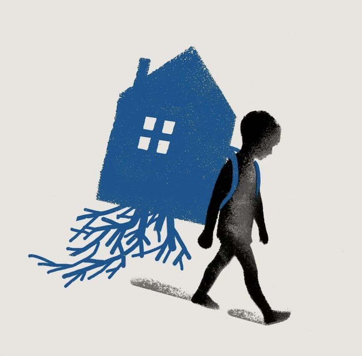 a child walking past a house with snow on it's roof and trees in the background