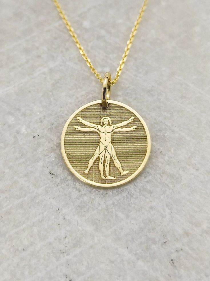 Welcome to RedGiftBox, it is our pleasure providing you our fine gold jewelry! Information about the pendant: - 14K Real Gold - 0.5mm Thick - Jumpring Diameter: 4mm Sizes Available: - 13mm / 0.52 inches - 15mm / 0.59 inches - 18mm / 0.70 inches - 20mm / 0.78 inches - 22mm / 0.86 inches - 24mm / 0.94 inches ▪️ We can engrave the back of your pendant with your custom personalized message, text, name or date for FREE! We recommend 5 lines with a maximum of 15 characters on each line. Information ab Painting Jewelry, Message Text, Man Necklace, Vitruvian Man, Painting Gold, Fine Gold Jewelry, Solid Gold Necklace, Yellow Gold Pendants, Engraved Necklace